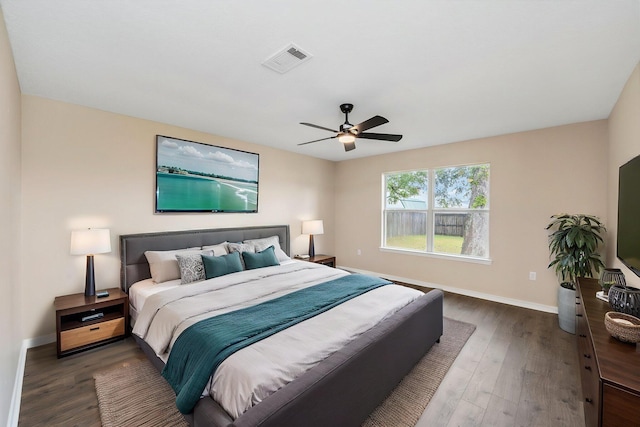 3167 Border Creek Dr, Crestview, FL 32539 - bedroom with baseboards, wood finished floors, and ceiling fan