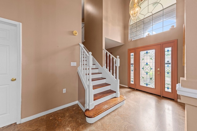 859 Mande Ct, Shalimar, FL 32579 - foyer with baseboards, stairs, and a towering ceiling