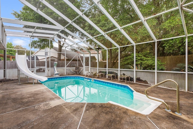 859 Mande Ct, Shalimar, FL 32579 - view of swimming pool featuring a water slide, a fenced backyard, and a patio area