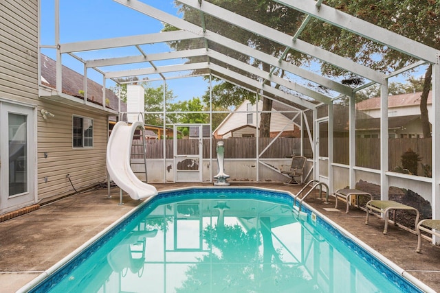 859 Mande Ct, Shalimar, FL 32579 - view of swimming pool featuring a water slide, a fenced backyard, a lanai, and a patio area