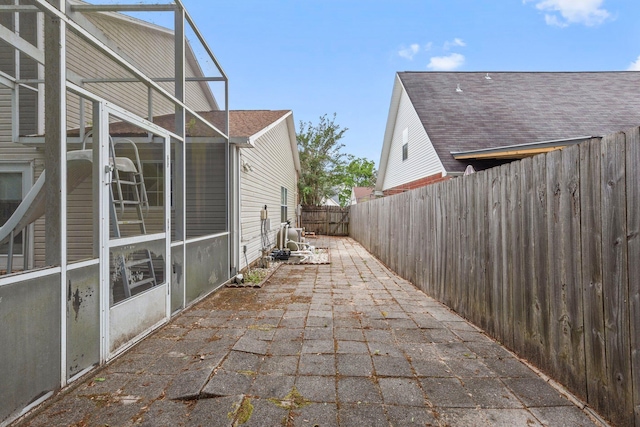 859 Mande Ct, Shalimar, FL 32579 - view of side of property with a patio area, a fenced backyard, and roof with shingles