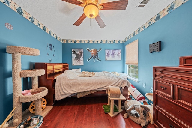 859 Mande Ct, Shalimar, FL 32579 - bedroom featuring wood finished floors, ceiling fan, and a textured ceiling
