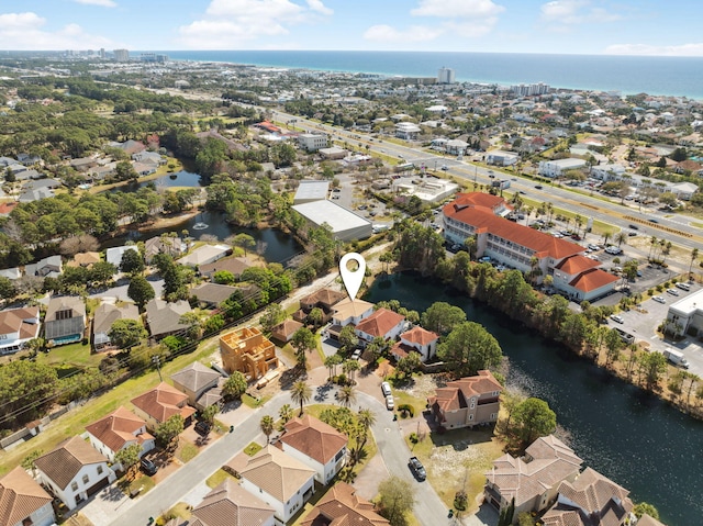 aerial perspective of suburban area featuring a nearby body of water
