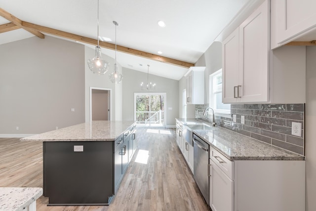1432 Madelyn Woods Dr, Pensacola, FL 32506 - kitchen with dishwasher, a kitchen island, white cabinetry, backsplash, and light wood finished floors