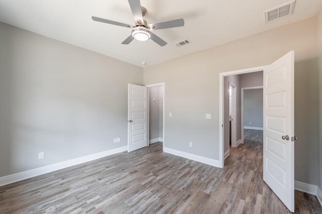 1432 Madelyn Woods Dr, Pensacola, FL 32506 - unfurnished bedroom featuring wood finished floors, baseboards, and ceiling fan