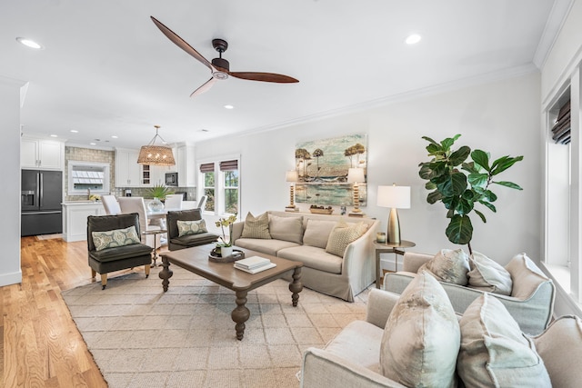 196 Summer Breeze Ln, Santa Rosa Beach, FL 32459 - living area with a ceiling fan, ornamental molding, light wood-type flooring, and recessed lighting