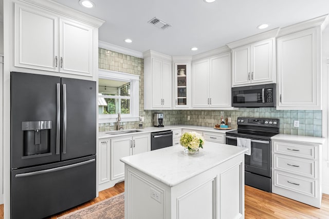 196 Summer Breeze Ln, Santa Rosa Beach, FL 32459 - kitchen featuring stainless steel fridge with ice dispenser, black range with electric stovetop, a sink, dishwasher, and white cabinetry
