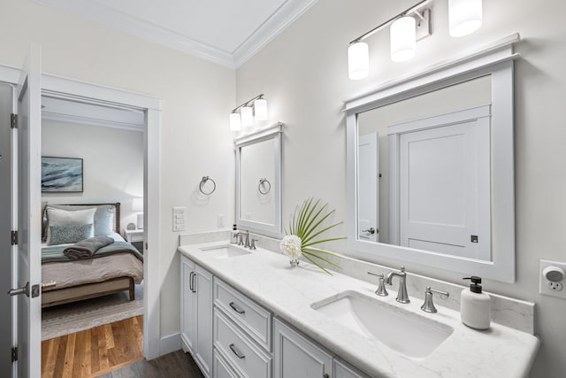 196 Summer Breeze Ln, Santa Rosa Beach, FL 32459 - ensuite bathroom featuring crown molding, wood finished floors, and double vanity