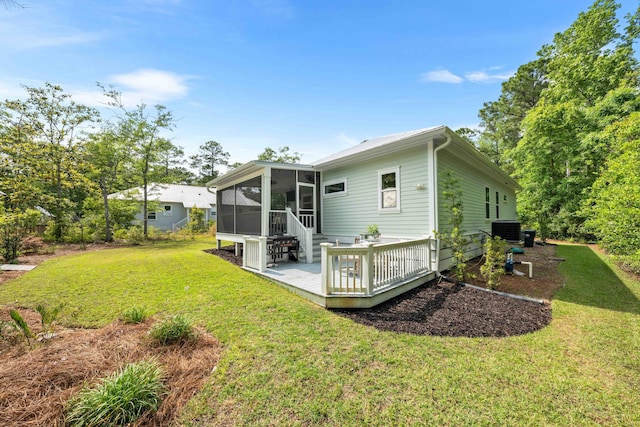196 Summer Breeze Ln, Santa Rosa Beach, FL 32459 - rear view of property featuring a sunroom, a lawn, central AC unit, and a wooden deck