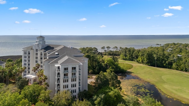 bird's eye view of a local golf course and a large body of water