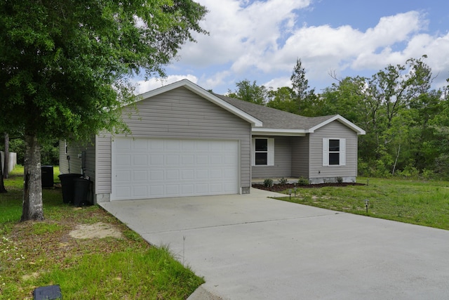 1422 Oakwood Lakes Blvd, Defuniak Springs, FL 32433 - ranch-style house featuring driveway, an attached garage, and a front lawn