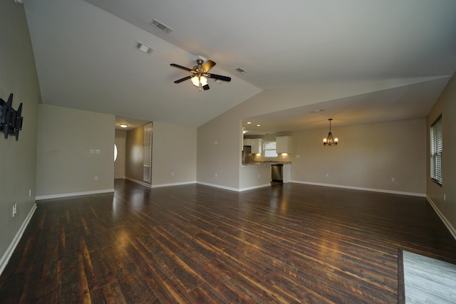 1422 Oakwood Lakes Blvd, Defuniak Springs, FL 32433 - unfurnished living room featuring vaulted ceiling, a chandelier, dark wood finished floors, a ceiling fan, and baseboards