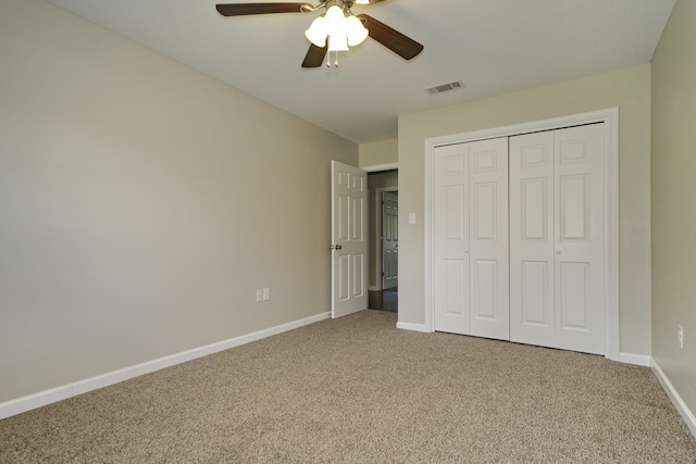 1422 Oakwood Lakes Blvd, Defuniak Springs, FL 32433 - unfurnished bedroom with carpet floors, baseboards, a closet, and a ceiling fan