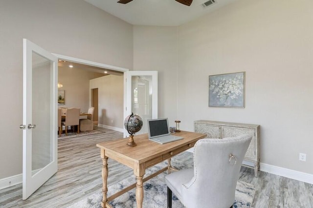 6216 Plum Orchard Way, Crestview, FL 32536 - office with light wood-style floors, a ceiling fan, baseboards, and high vaulted ceiling