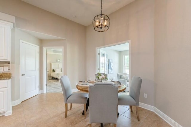 6216 Plum Orchard Way, Crestview, FL 32536 - dining space with a chandelier, light tile patterned flooring, and baseboards
