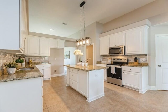 6216 Plum Orchard Way, Crestview, FL 32536 - kitchen featuring appliances with stainless steel finishes, a sink, tasteful backsplash, and light stone countertops