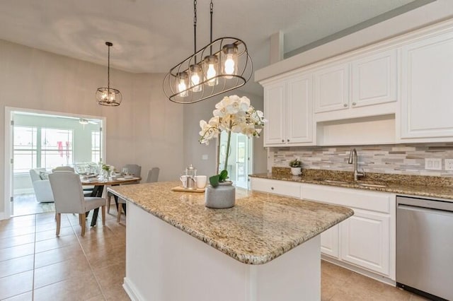 6216 Plum Orchard Way, Crestview, FL 32536 - kitchen with stainless steel dishwasher, a sink, light tile patterned floors, and backsplash