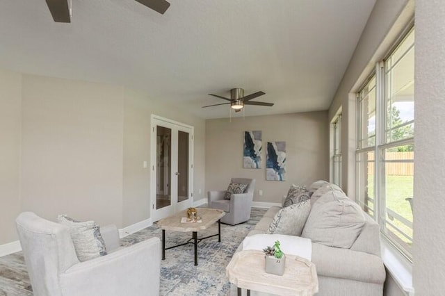 6216 Plum Orchard Way, Crestview, FL 32536 - living room with ceiling fan, baseboards, french doors, and light wood-type flooring