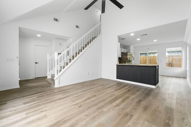 1725 Colonial Ct, Fort Walton Beach, FL 32547 - unfurnished living room with stairway, ceiling fan, light wood-style floors, recessed lighting, and baseboards