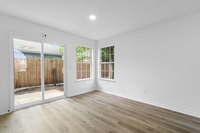 1725 Colonial Ct, Fort Walton Beach, FL 32547 - spare room featuring wood finished floors, baseboards, recessed lighting, and a textured ceiling