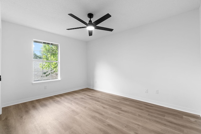 1725 Colonial Ct, Fort Walton Beach, FL 32547 - unfurnished room with wood finished floors, baseboards, and a ceiling fan