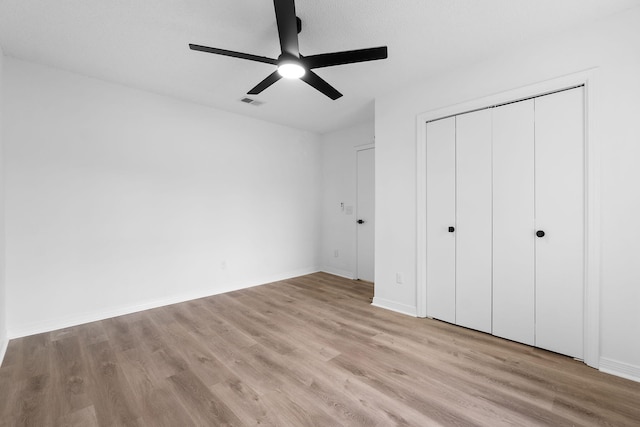 1725 Colonial Ct, Fort Walton Beach, FL 32547 - unfurnished bedroom featuring light wood-style floors, a closet, baseboards, and a ceiling fan