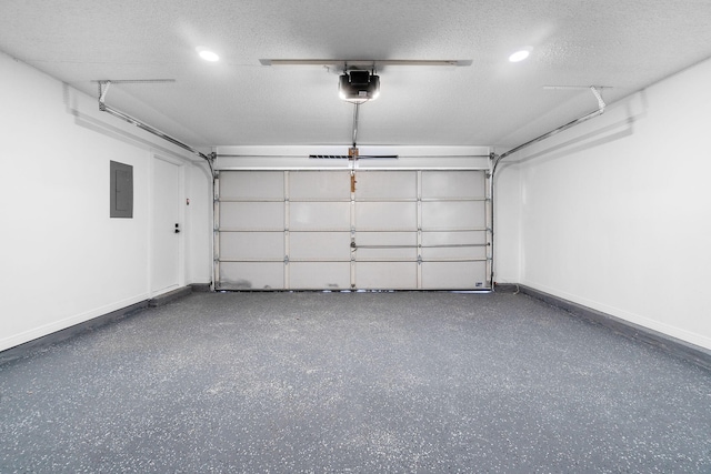 1725 Colonial Ct, Fort Walton Beach, FL 32547 - garage featuring electric panel, baseboards, a garage door opener, and recessed lighting