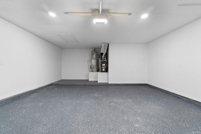 1725 Colonial Ct, Fort Walton Beach, FL 32547 - garage featuring water heater, baseboards, recessed lighting, and heating unit