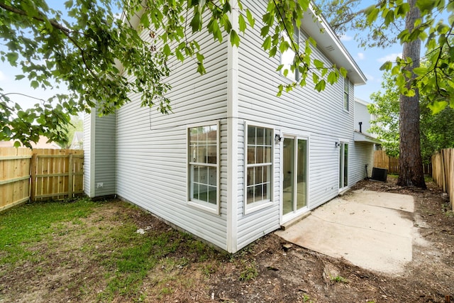 1725 Colonial Ct, Fort Walton Beach, FL 32547 - back of house with a fenced backyard, a patio area, and cooling unit