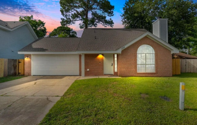 1725 Colonial Ct, Fort Walton Beach, FL 32547 - view of front of house featuring a chimney, brick siding, a garage, and driveway