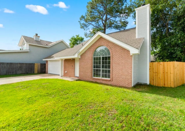 1725 Colonial Ct, Fort Walton Beach, FL 32547 - view of front of home with driveway, a chimney, an attached garage, and brick siding