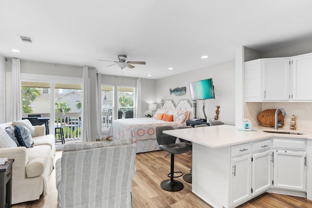 775 Gulf Shore Dr Unit 8250, Destin, FL 32541 - bedroom with a sink, access to exterior, light wood-style floors, recessed lighting, and ceiling fan