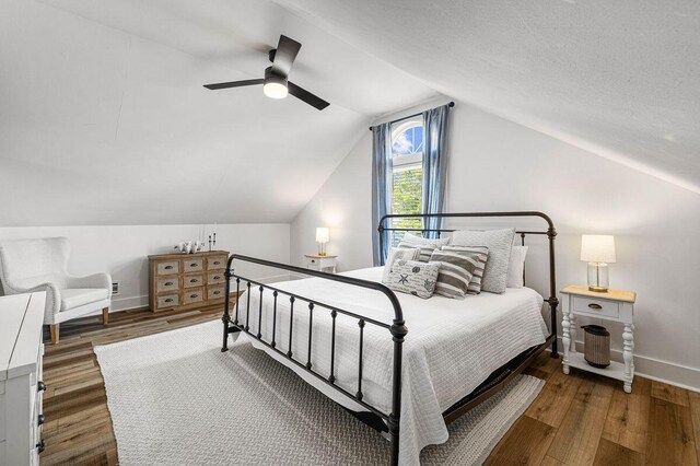65 Brown St, Santa Rosa Beach, FL 32459 - bedroom with baseboards, wood finished floors, vaulted ceiling, and a ceiling fan