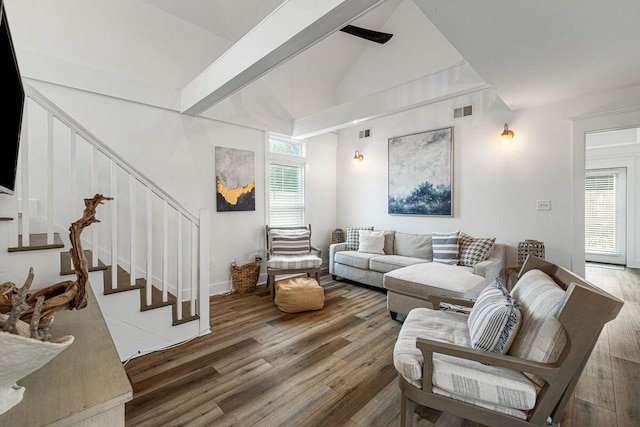 65 Brown St, Santa Rosa Beach, FL 32459 - living area featuring stairs, wood finished floors, beam ceiling, and high vaulted ceiling