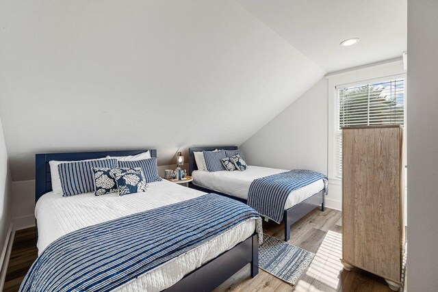 65 Brown St, Santa Rosa Beach, FL 32459 - bedroom with wood finished floors, lofted ceiling, and recessed lighting