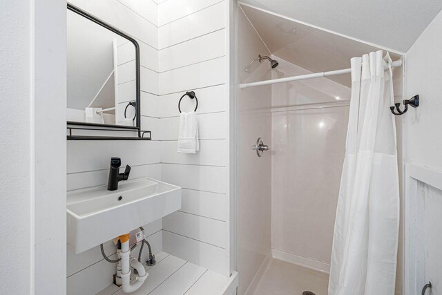 65 Brown St, Santa Rosa Beach, FL 32459 - bathroom with a shower stall and a sink
