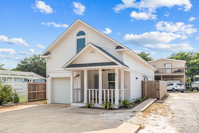 65 Brown St, Santa Rosa Beach, FL 32459 - view of front of home with a porch, a garage, driveway, and a shingled roof