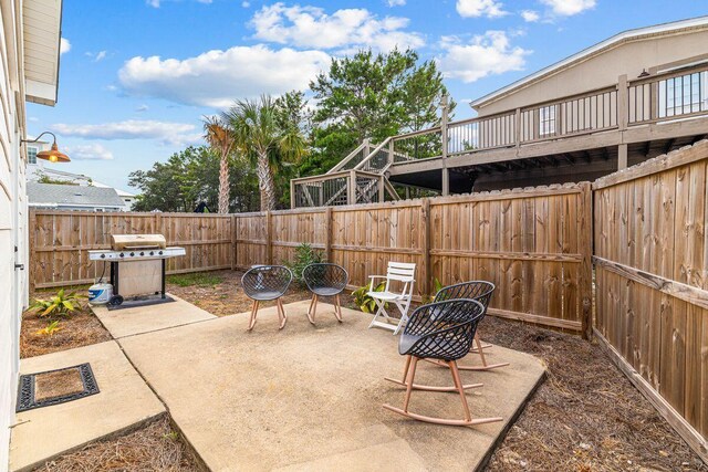 65 Brown St, Santa Rosa Beach, FL 32459 - fenced backyard featuring area for grilling and a patio area