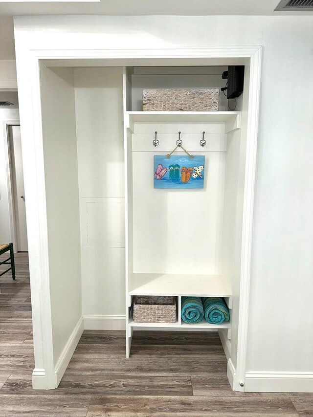 1096 Scenic Gulf Dr Ph 1610, Miramar Beach, FL 32550 - mudroom featuring wood finished floors and baseboards