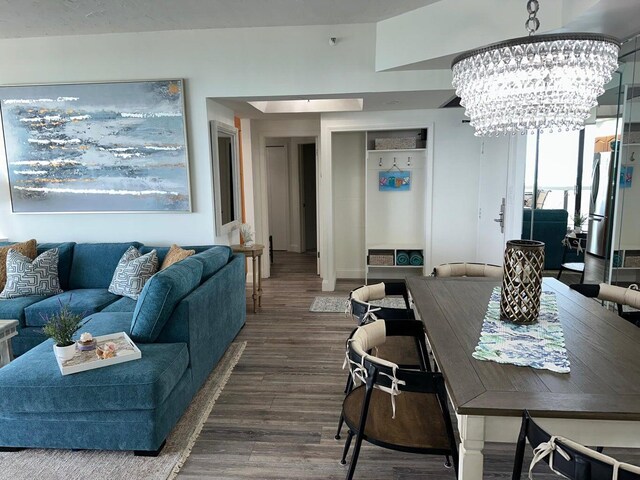 1096 Scenic Gulf Dr Ph 1610, Miramar Beach, FL 32550 - living room featuring a chandelier and wood finished floors