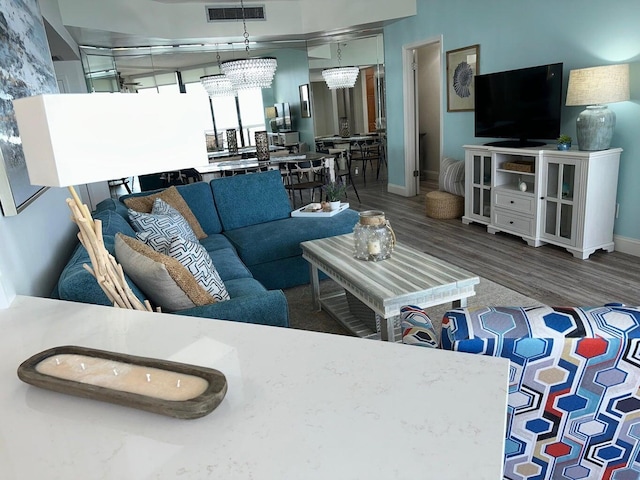 1096 Scenic Gulf Dr Ph 1610, Miramar Beach, FL 32550 - living room featuring wood finished floors and baseboards