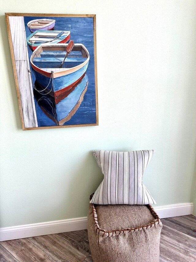 1096 Scenic Gulf Dr Ph 1610, Miramar Beach, FL 32550 - living area with baseboards and wood finished floors