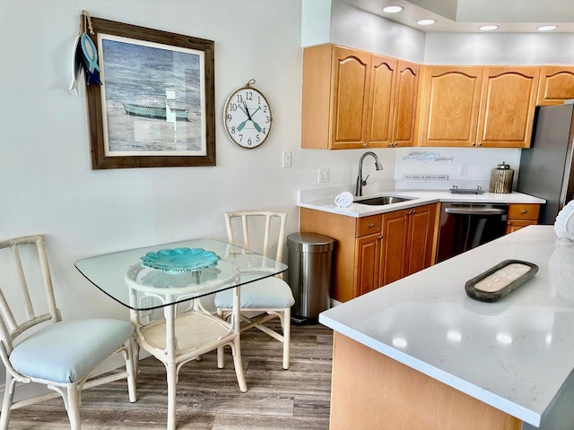 1096 Scenic Gulf Dr Ph 1610, Miramar Beach, FL 32550 - kitchen featuring dishwasher, a sink, light wood-style flooring, light countertops, and freestanding refrigerator