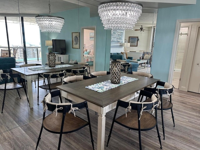 1096 Scenic Gulf Dr Ph 1610, Miramar Beach, FL 32550 - dining room featuring a chandelier, wood finished floors, and healthy amount of natural light