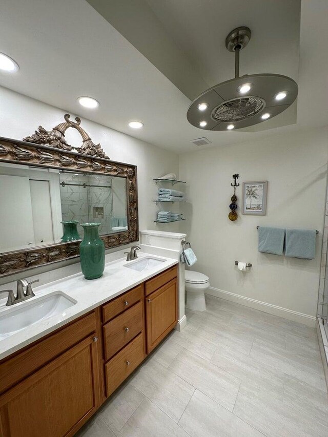 1096 Scenic Gulf Dr Ph 1610, Miramar Beach, FL 32550 - bathroom with a shower with shower door, toilet, double vanity, and recessed lighting