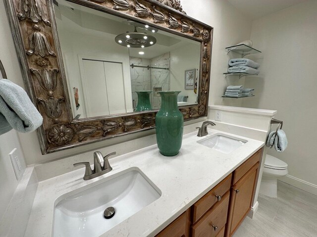 1096 Scenic Gulf Dr Ph 1610, Miramar Beach, FL 32550 - bathroom with a shower with door, toilet, and double vanity