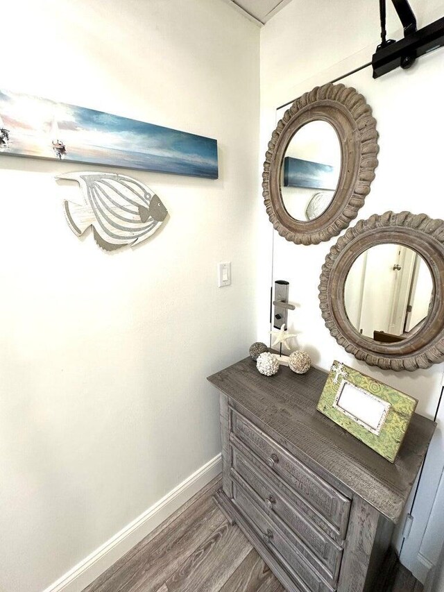 1096 Scenic Gulf Dr Ph 1610, Miramar Beach, FL 32550 - bathroom featuring baseboards and wood finished floors