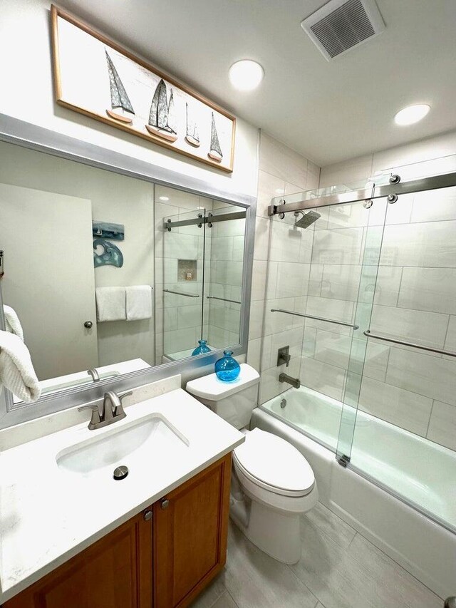 1096 Scenic Gulf Dr Ph 1610, Miramar Beach, FL 32550 - full bath with vanity, enclosed tub / shower combo, toilet, and recessed lighting