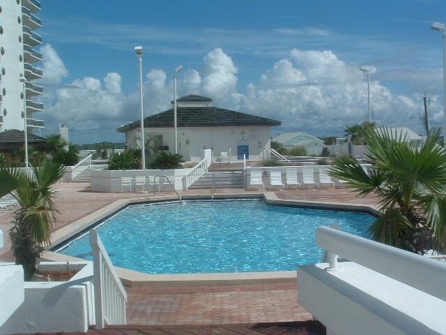 1096 Scenic Gulf Dr Ph 1610, Miramar Beach, FL 32550 - community pool featuring a patio, a gazebo, and stairs