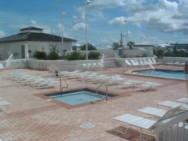 1096 Scenic Gulf Dr Ph 1610, Miramar Beach, FL 32550 - community pool with a hot tub, a patio area, and fence